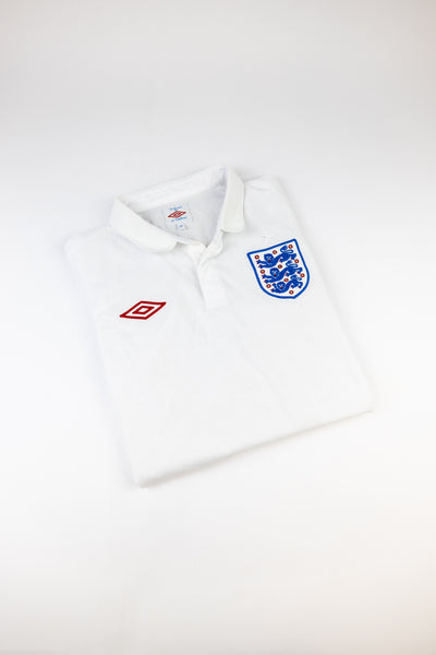 2010 England football shirt made by Umbro available in various sizes.